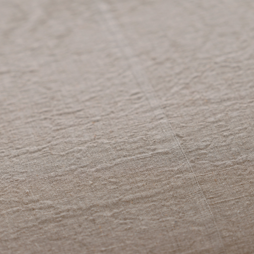 Close-up of beige textured fabric