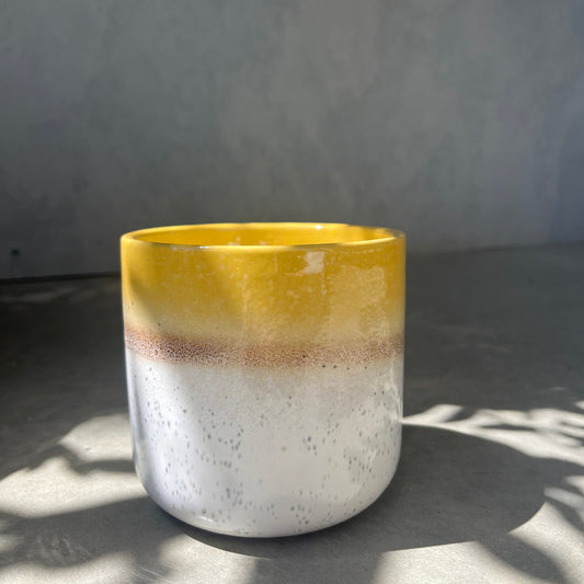 Scented candle in ceramic vessel