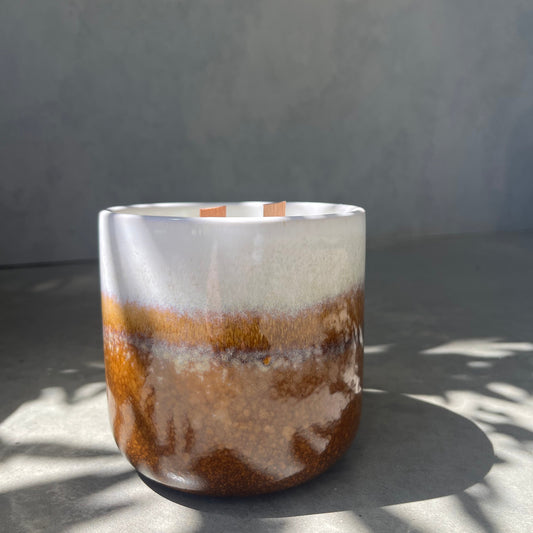 Scented candle in ceramic vessel