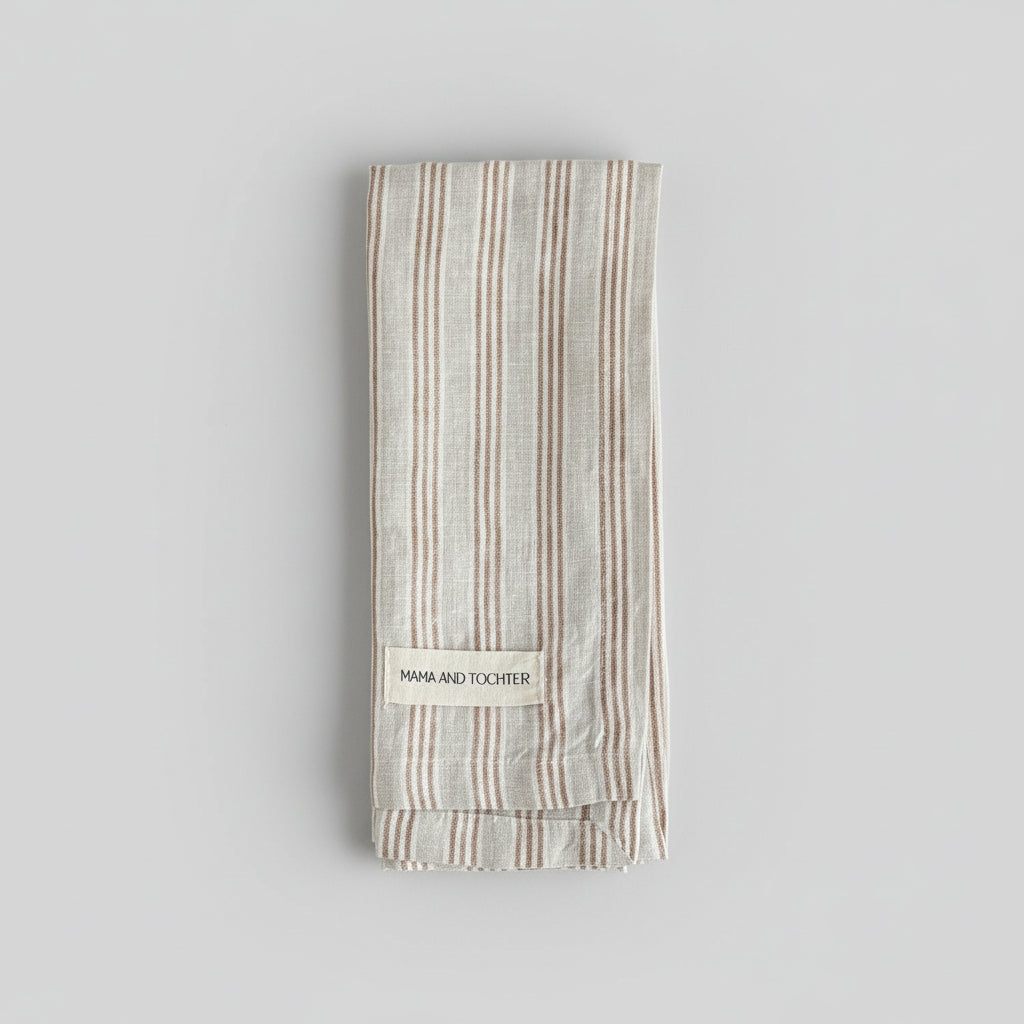 Striped tea towel with a brand label