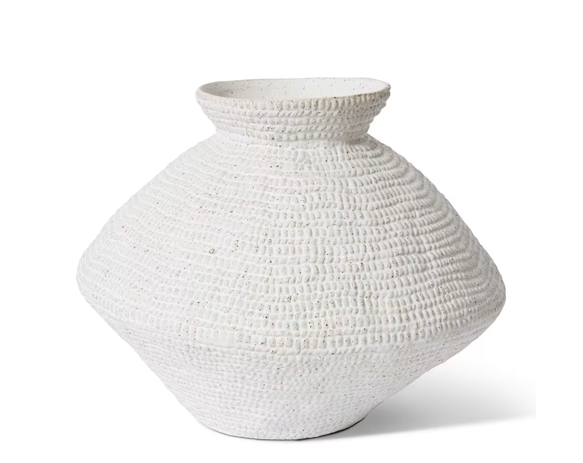 A large, textured white ceramic vase with a wide, rounded body and a short flared neck, shown on a clean white background.