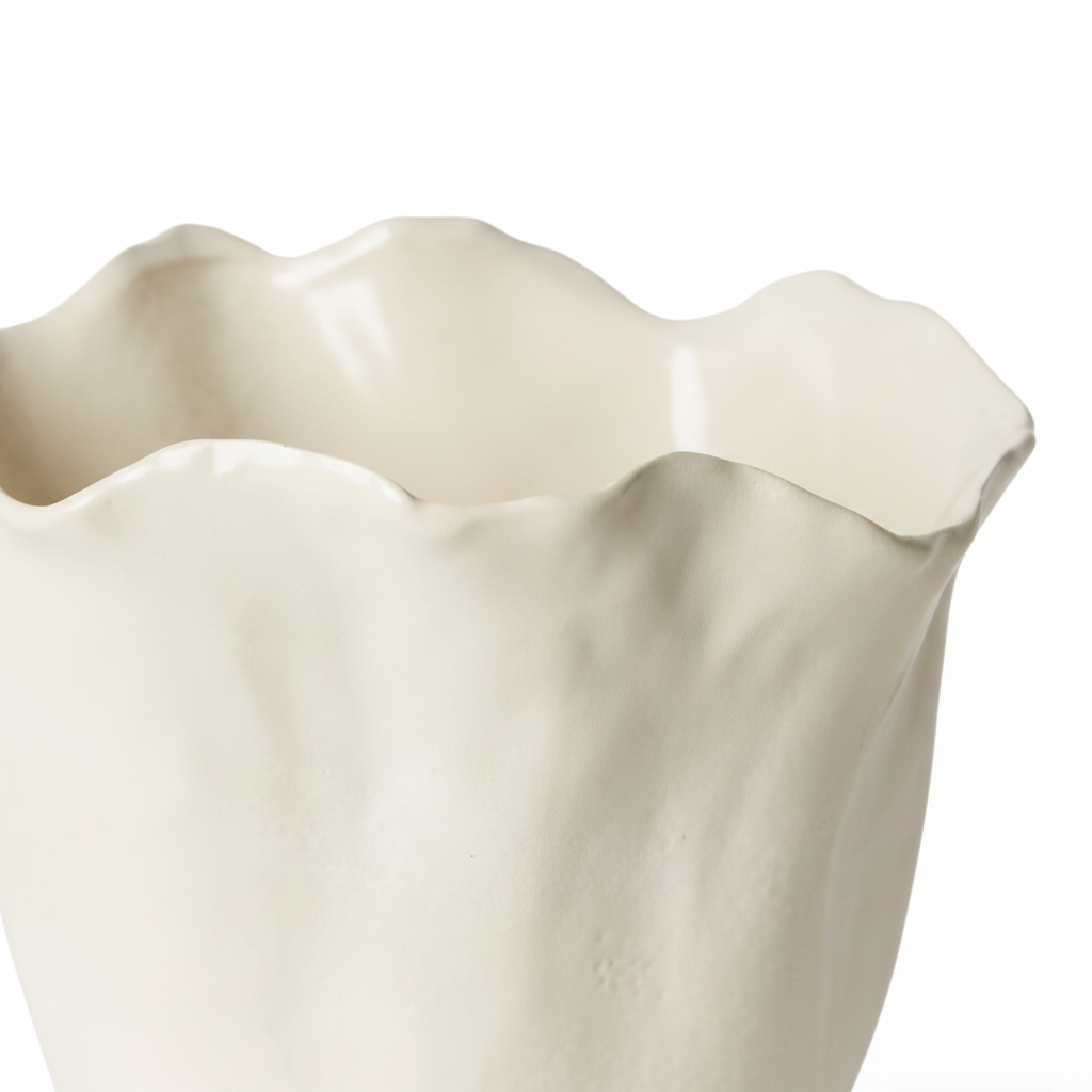 An off-white ceramic vase with a wavy, scalloped rim and a textured, organic shape, shown on a white background with a soft shadow.