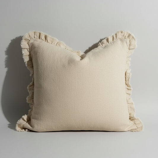 Close-up of a beige pillow with ruffled edge 